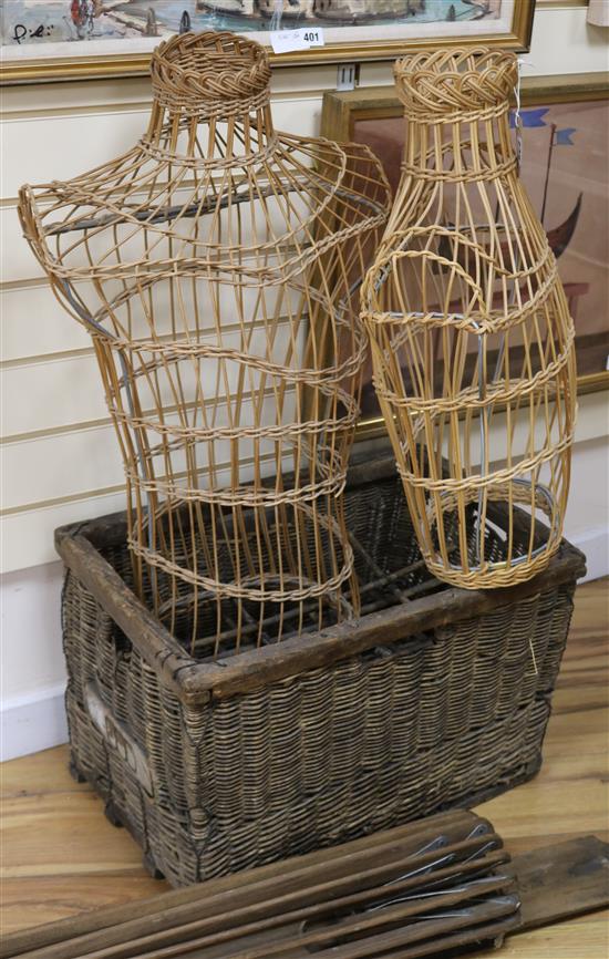 Two wicker tailors dummies and a wine basket and clothes dryer